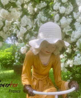 Girl on bike under philadelphus (1)